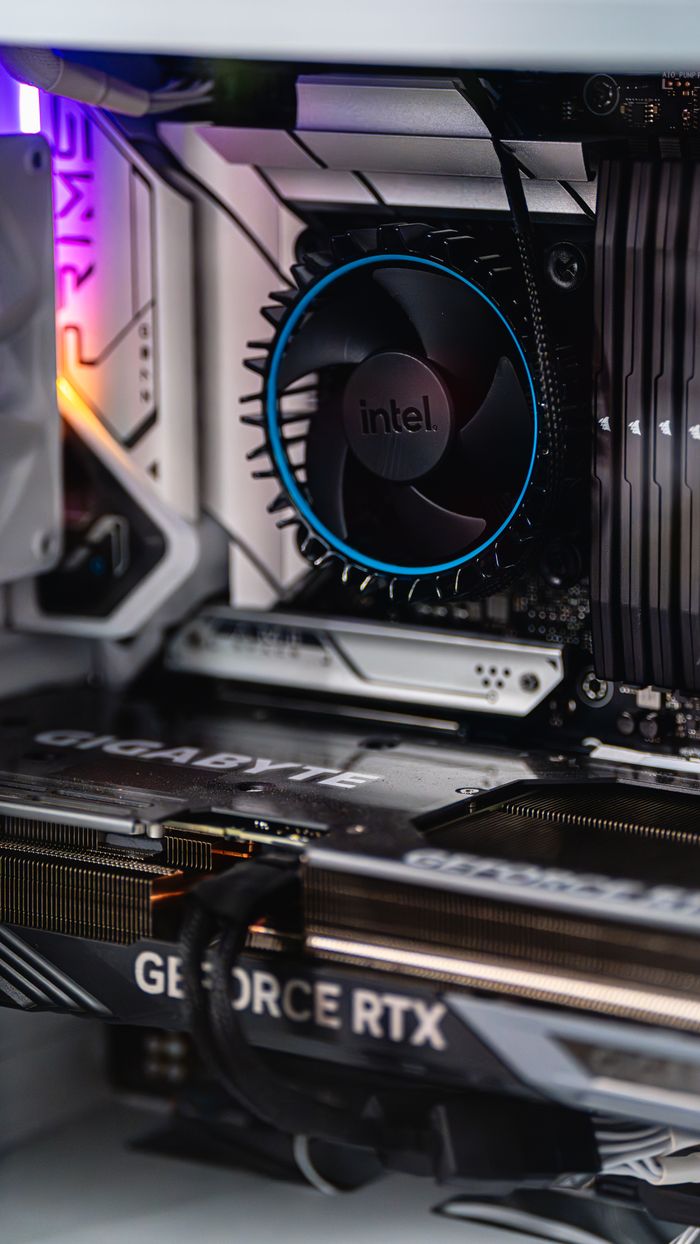 Services Close-up of a gaming PC showcasing GeForce RTX graphics card and Intel CPU fan.