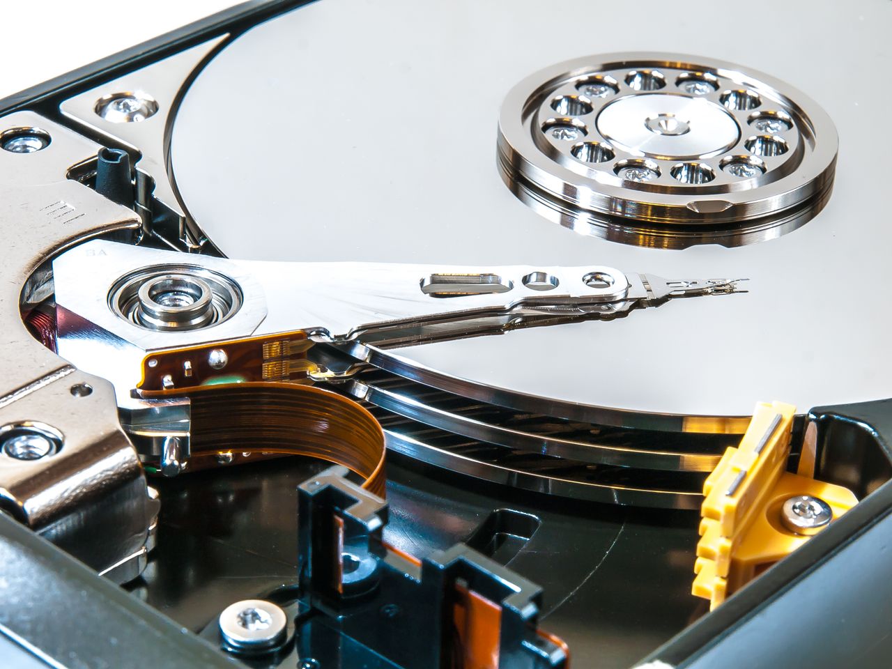 The Art of Drawing Readers In: Your attractive post title goes here Detailed view of an open hard drive showing its internal mechanisms and disk platters.