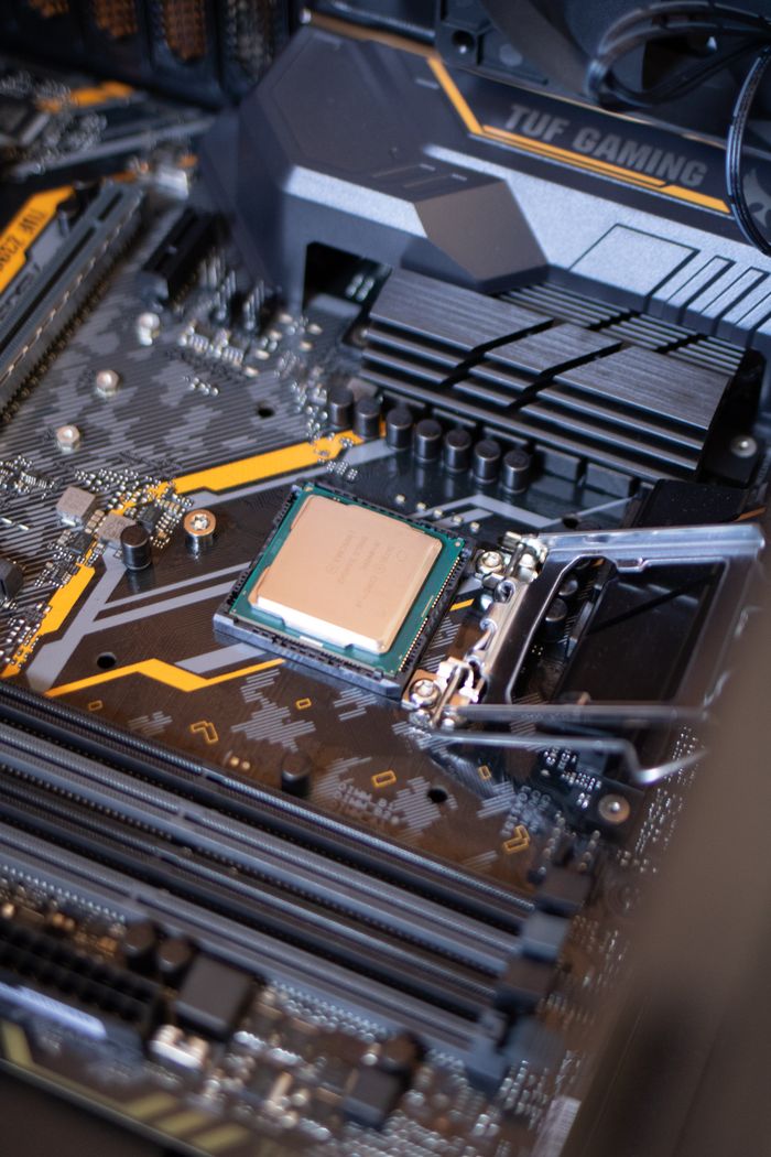Mastering the First Impression: Your intriguing post title goes here Detailed view of a motherboard with an exposed CPU, showcasing technology components.